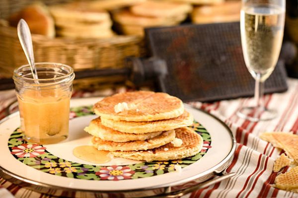 Champagne in Dixie Cups. Pancakes Flecked with Gold Fine dining is fun again